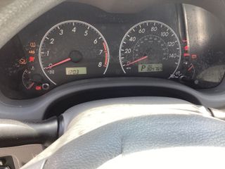 2010 Toyota Corolla LE - Interior Dashboard With Vehicle Running Image